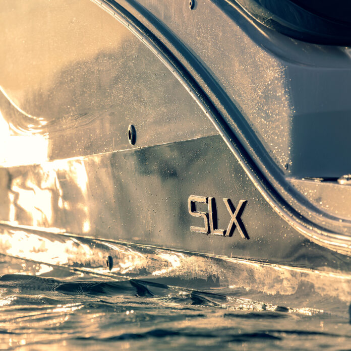 SLX 360 Outboard hull and badge detail at sunset