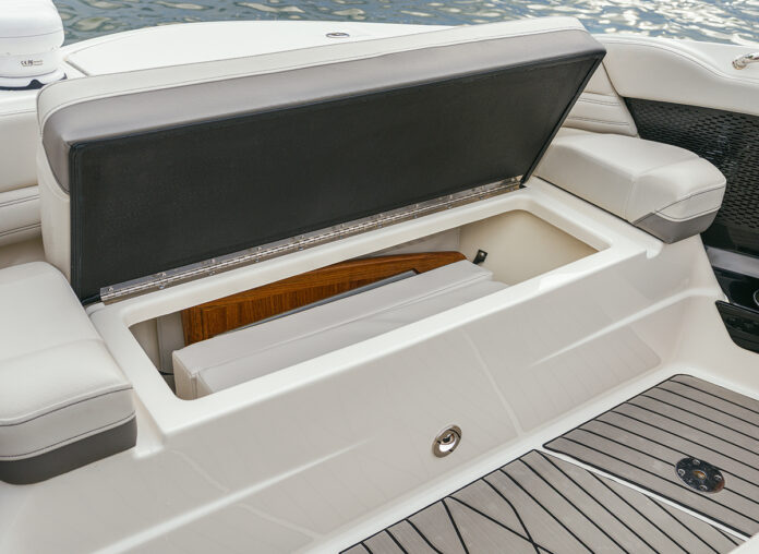 Person revealing the bow storage on an SLX 360 Outboard